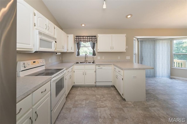 563 Great Plains Dr, House Springs, MO 63051 - kitchen with white appliances, a peninsula, light countertops, white cabinets, and recessed lighting