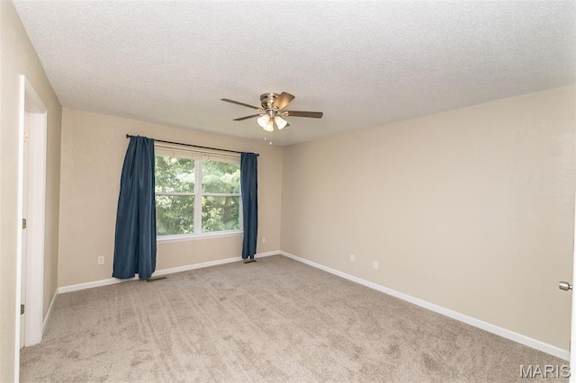 563 Great Plains Dr, House Springs, MO 63051 - empty room with ceiling fan, a textured ceiling, and light colored carpet
