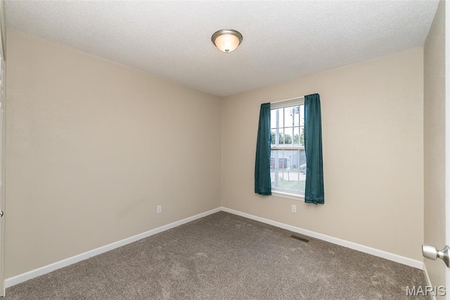 563 Great Plains Dr, House Springs, MO 63051 - carpeted empty room featuring a textured ceiling and baseboards