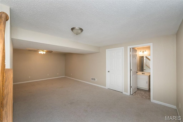 563 Great Plains Dr, House Springs, MO 63051 - unfurnished bedroom featuring carpet floors, ensuite bath, and a textured ceiling