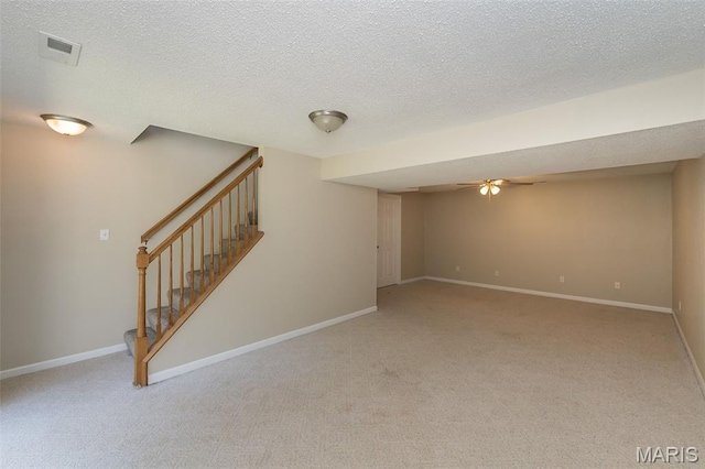 563 Great Plains Dr, House Springs, MO 63051 - finished below grade area featuring a ceiling fan, carpet, stairway, and a textured ceiling