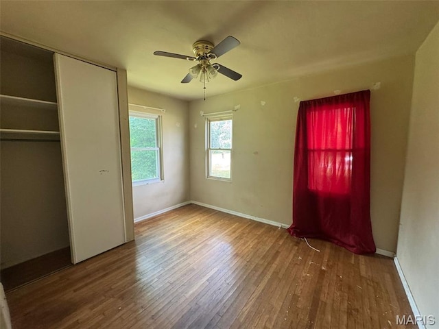 6 Maple Dr, Caseyville, IL 62232 - unfurnished bedroom with wood finished floors, a closet, and ceiling fan