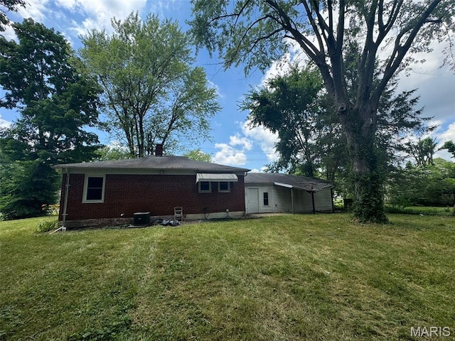 6 Maple Dr, Caseyville, IL 62232 - rear view of property with brick siding, a yard, and a chimney