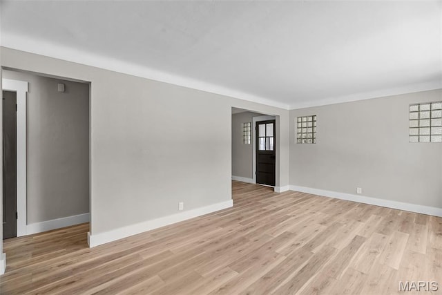 6736 Julian Ave, University City, MO 63130 - unfurnished room with light wood finished floors and baseboards