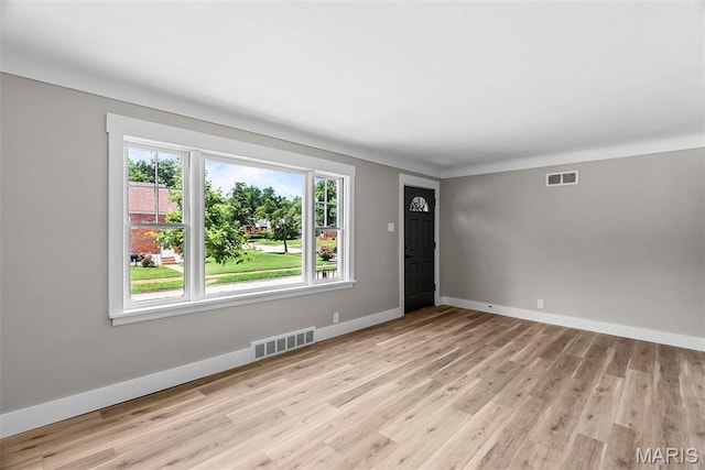 6736 Julian Ave, University City, MO 63130 - unfurnished room featuring baseboards and light wood-style flooring