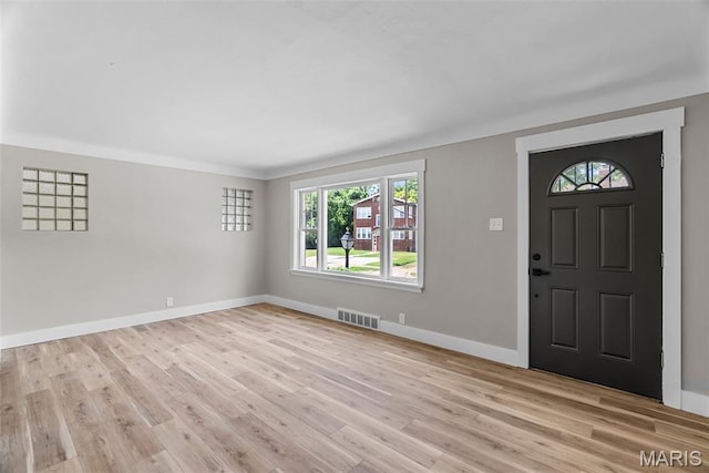 6736 Julian Ave, University City, MO 63130 - entryway featuring healthy amount of natural light and light wood-style floors