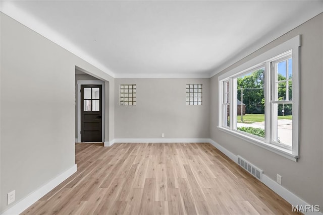 6736 Julian Ave, University City, MO 63130 - unfurnished room with baseboards and light wood-type flooring