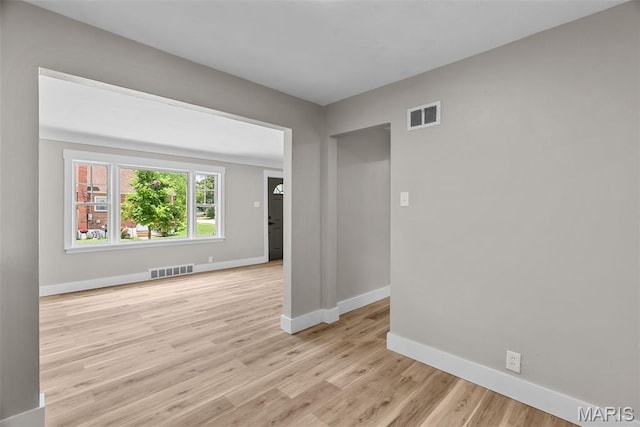 6736 Julian Ave, University City, MO 63130 - unfurnished room featuring baseboards and light wood finished floors