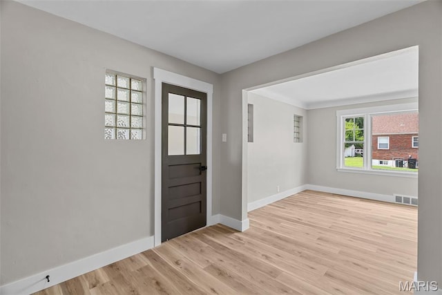 6736 Julian Ave, University City, MO 63130 - entryway featuring light wood-type flooring and baseboards