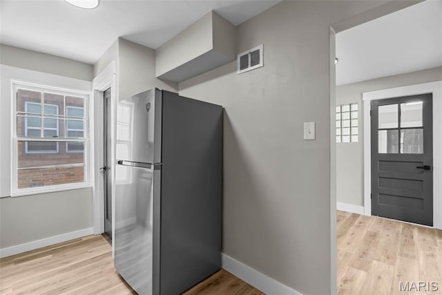 6736 Julian Ave, University City, MO 63130 - kitchen with freestanding refrigerator and light wood-style flooring