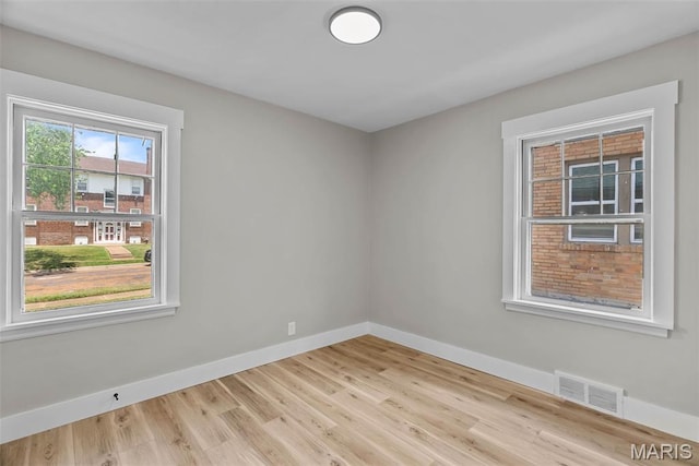 6736 Julian Ave, University City, MO 63130 - empty room with baseboards and wood finished floors