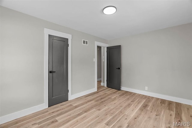 6736 Julian Ave, University City, MO 63130 - spare room featuring light wood-style flooring