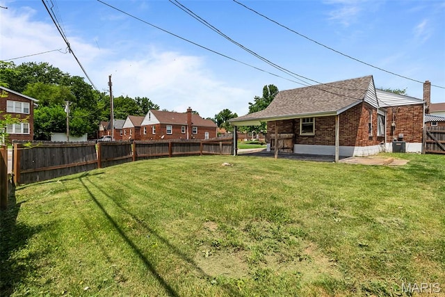 6736 Julian Ave, University City, MO 63130 - fenced backyard featuring a patio area