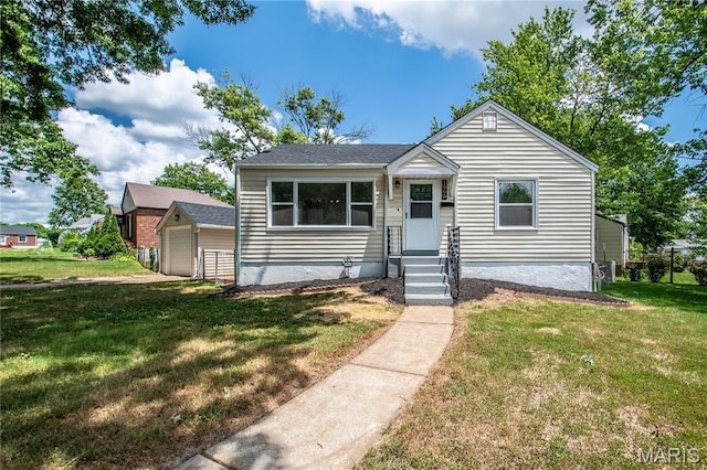 1900 Owen Dr, Hanley Hills, MO 63133 - bungalow-style house featuring a detached garage, a front yard, and an outbuilding