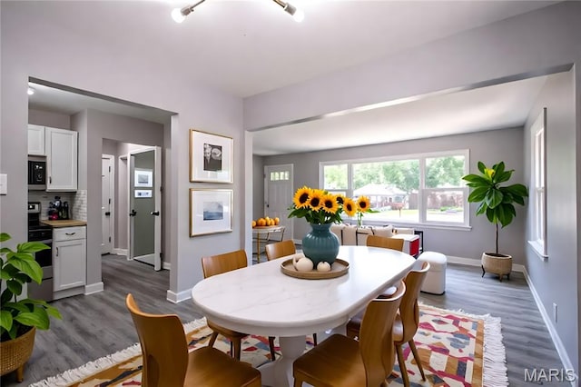 1900 Owen Dr, Hanley Hills, MO 63133 - dining area featuring baseboards and dark wood-style floors