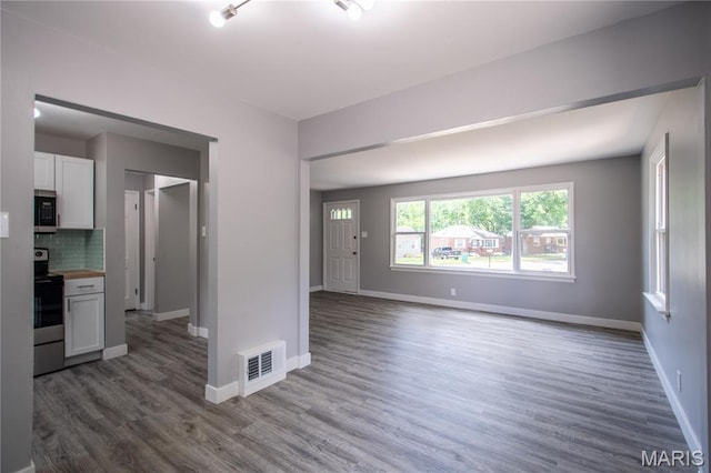 1900 Owen Dr, Hanley Hills, MO 63133 - unfurnished living room featuring dark wood-type flooring and baseboards