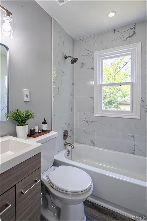 1900 Owen Dr, Hanley Hills, MO 63133 - bathroom featuring vanity, tub / shower combination, and recessed lighting