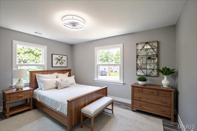 1900 Owen Dr, Hanley Hills, MO 63133 - bedroom featuring multiple windows and wood finished floors