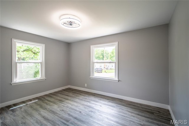 1900 Owen Dr, Hanley Hills, MO 63133 - spare room featuring plenty of natural light and wood finished floors