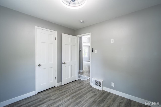 1900 Owen Dr, Hanley Hills, MO 63133 - unfurnished bedroom featuring baseboards and wood finished floors