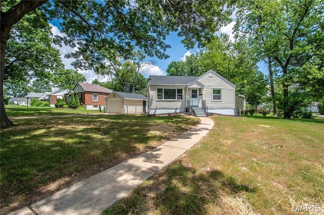 1900 Owen Dr, Hanley Hills, MO 63133 - view of front of house with a detached garage, a front yard, and an outbuilding