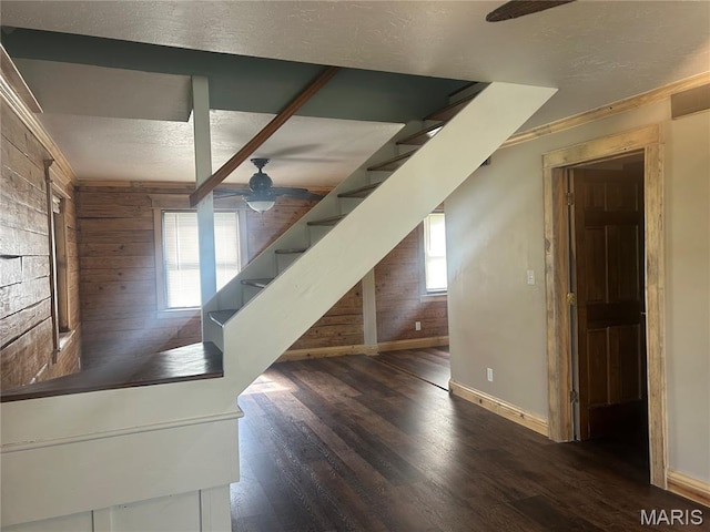 619 Don St, Poplar Bluff, MO 63901 - staircase with a ceiling fan, wooden walls, wood finished floors, crown molding, and a textured ceiling