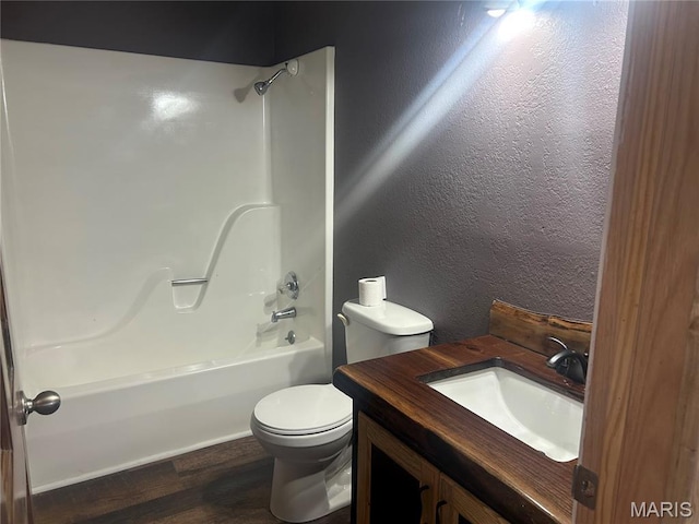 619 Don St, Poplar Bluff, MO 63901 - bathroom featuring bathing tub / shower combination, wood finished floors, a textured wall, and vanity