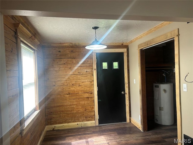 619 Don St, Poplar Bluff, MO 63901 - entryway featuring electric water heater, wood walls, a textured ceiling, wood finished floors, and ornamental molding