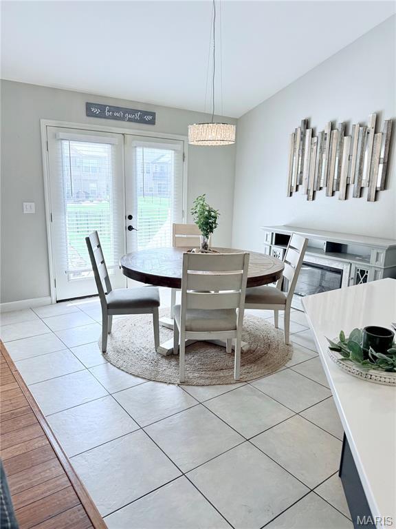 2354 Fountain Dr, Barnhart, MO 63012 - dining area with light tile patterned flooring and french doors