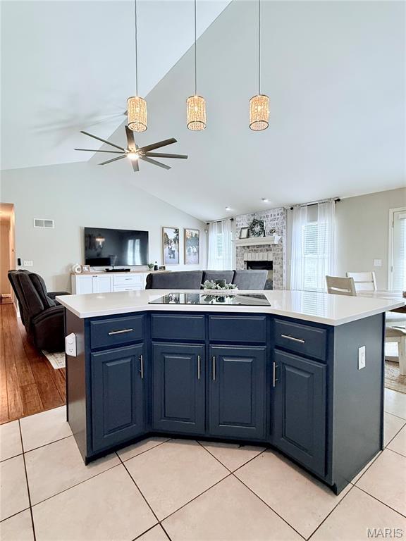 2354 Fountain Dr, Barnhart, MO 63012 - kitchen with open floor plan, black electric stovetop, healthy amount of natural light, and vaulted ceiling