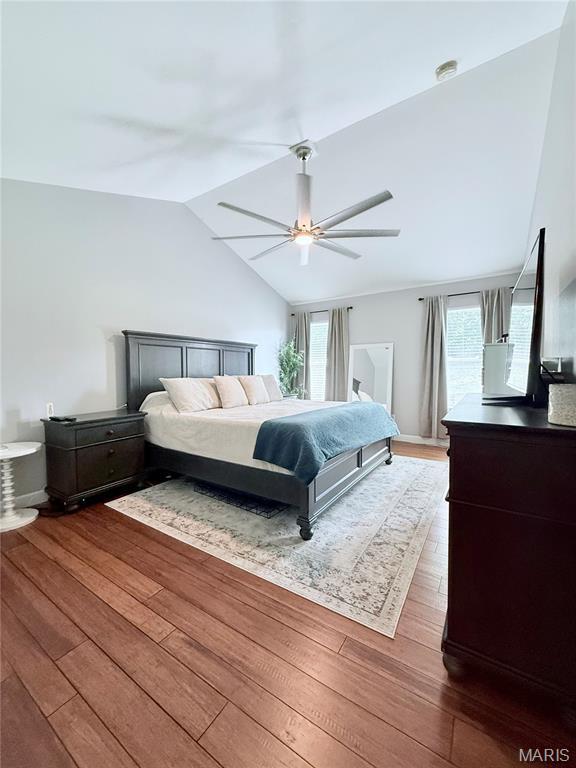 2354 Fountain Dr, Barnhart, MO 63012 - bedroom with lofted ceiling, hardwood / wood-style flooring, multiple windows, and a ceiling fan