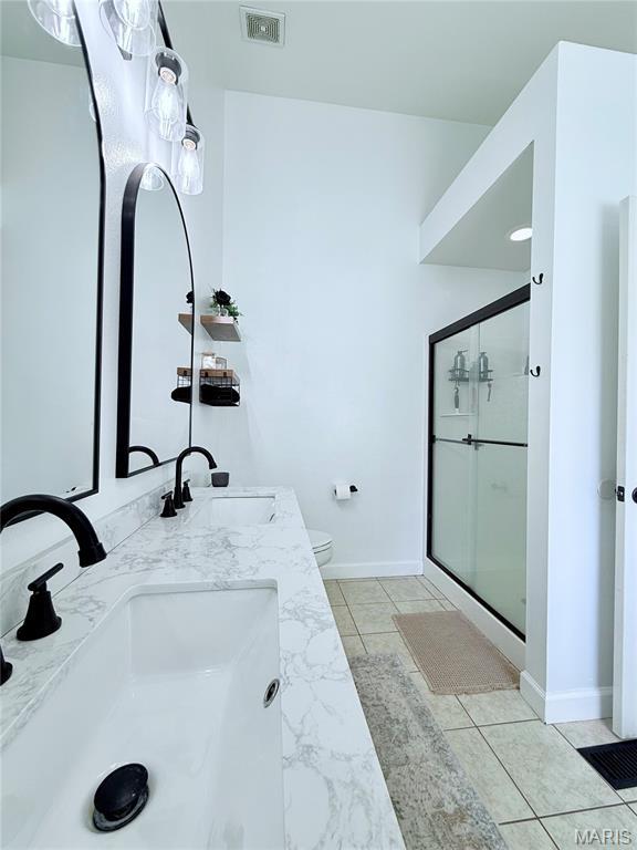 2354 Fountain Dr, Barnhart, MO 63012 - bathroom featuring double vanity, a stall shower, and marble finish floors