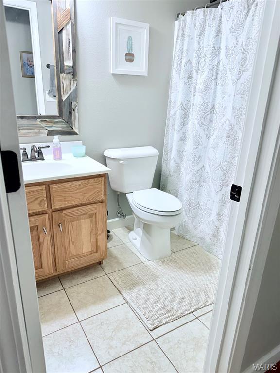 2354 Fountain Dr, Barnhart, MO 63012 - bathroom featuring vanity, tile patterned floors, and a shower with shower curtain