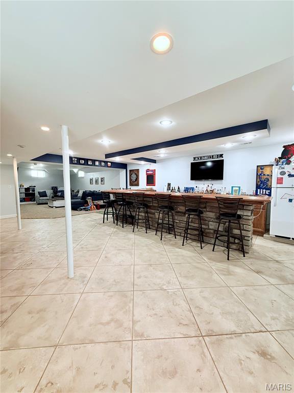 2354 Fountain Dr, Barnhart, MO 63012 - community bar area with freestanding refrigerator, light tile patterned floors, and recessed lighting