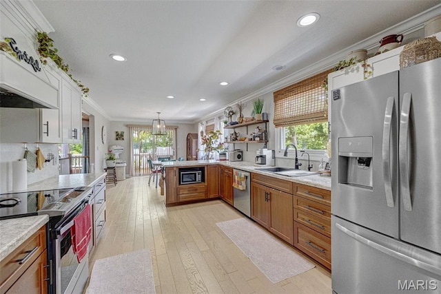 10317 Mallard Rd, Potosi, MO 63664 - kitchen featuring stainless steel appliances, ornamental molding, light countertops, healthy amount of natural light, and brown cabinets