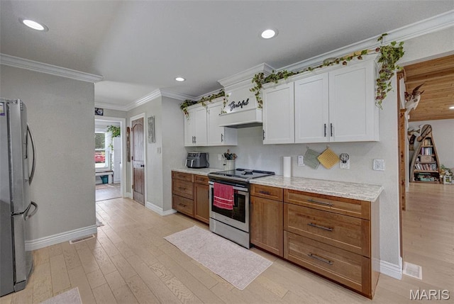 10317 Mallard Rd, Potosi, MO 63664 - kitchen with stainless steel appliances, white cabinets, light wood-style flooring, crown molding, and recessed lighting