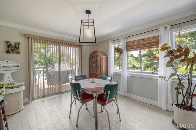 10317 Mallard Rd, Potosi, MO 63664 - dining space featuring crown molding, healthy amount of natural light, and light wood-style flooring