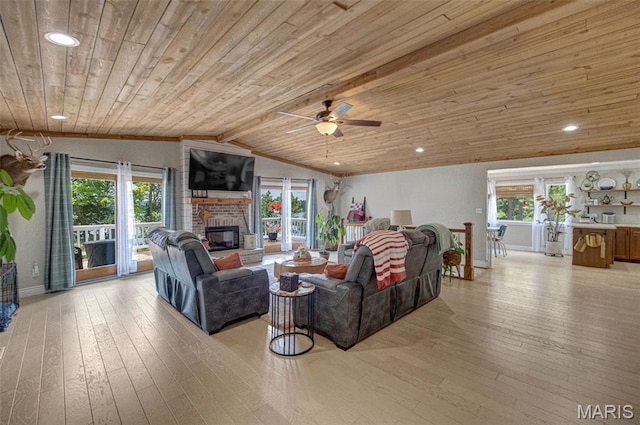 10317 Mallard Rd, Potosi, MO 63664 - living room featuring wooden ceiling, plenty of natural light, a brick fireplace, lofted ceiling, and a ceiling fan