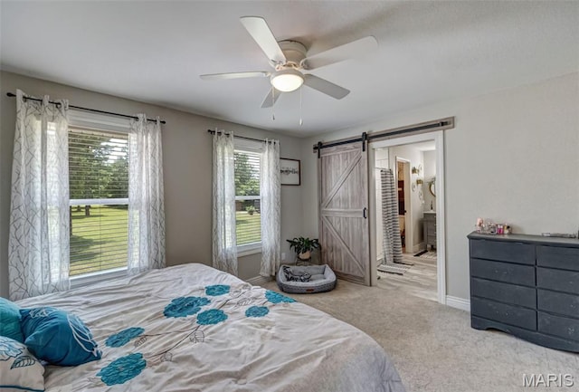 10317 Mallard Rd, Potosi, MO 63664 - carpeted bedroom featuring a barn door, a ceiling fan, and ensuite bathroom