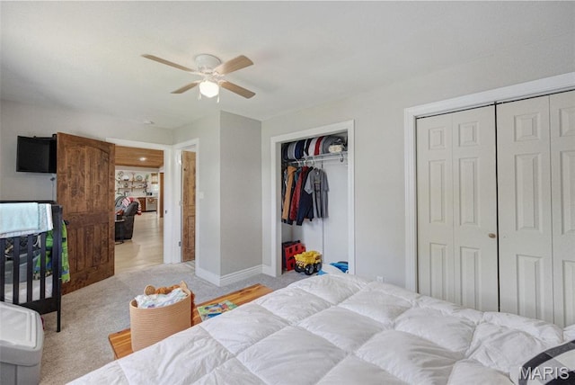 10317 Mallard Rd, Potosi, MO 63664 - bedroom with two closets, light colored carpet, and a ceiling fan