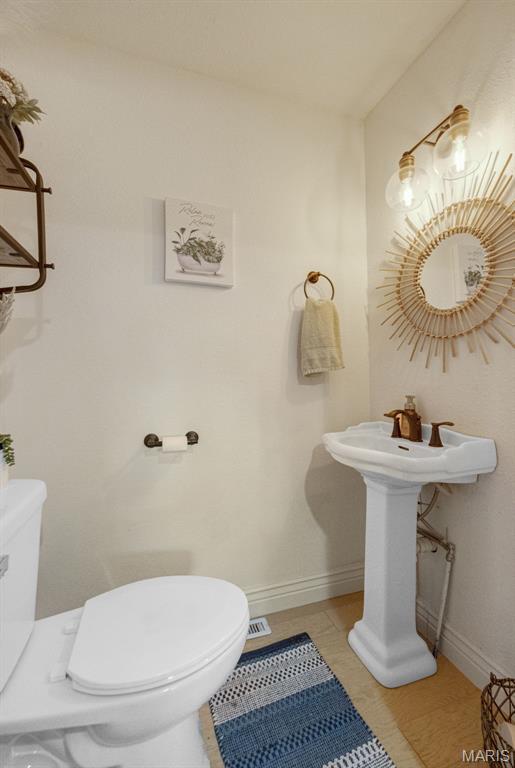 10317 Mallard Rd, Potosi, MO 63664 - half bath featuring toilet and tile patterned floors