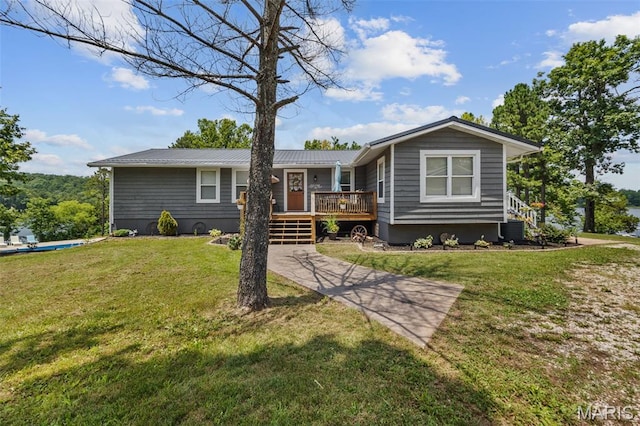 10317 Mallard Rd, Potosi, MO 63664 - single story home featuring a deck, a front yard, a metal roof, and stairs