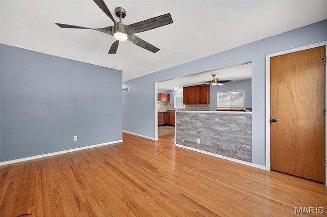 10564 Mert Ave, Saint Ann, MO 63074 - unfurnished living room with ceiling fan and light wood-style floors