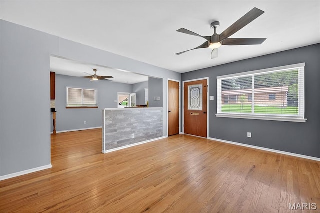 10564 Mert Ave, Saint Ann, MO 63074 - unfurnished living room with a ceiling fan and light wood-type flooring