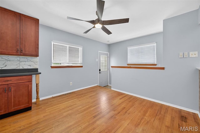 10564 Mert Ave, Saint Ann, MO 63074 - unfurnished dining area featuring a ceiling fan and light wood-style flooring