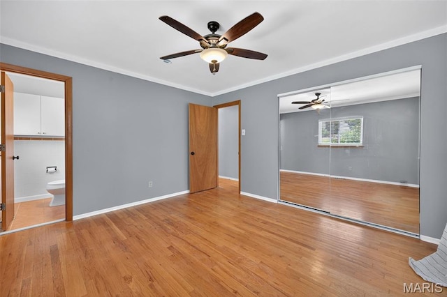 10564 Mert Ave, Saint Ann, MO 63074 - unfurnished bedroom featuring light wood finished floors, ornamental molding, a closet, a ceiling fan, and ensuite bath
