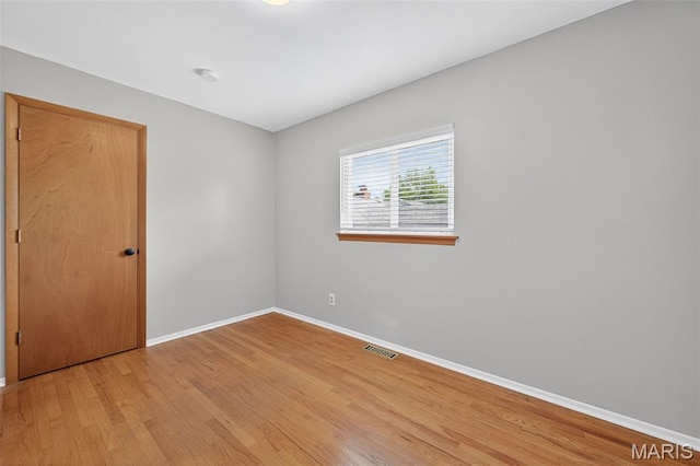 10564 Mert Ave, Saint Ann, MO 63074 - spare room featuring wood finished floors and a smoke detector