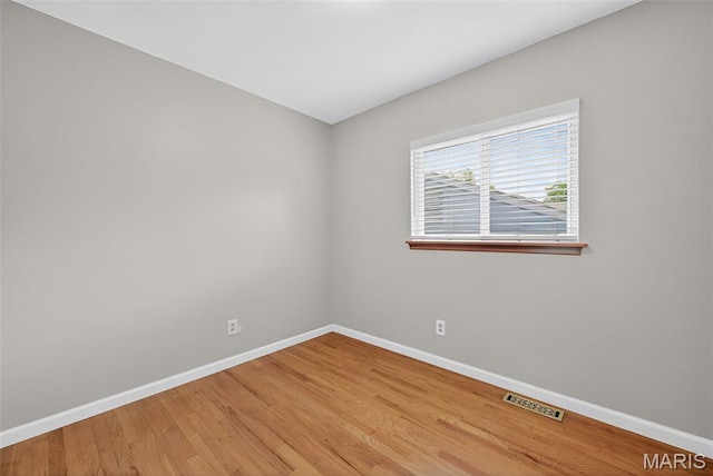 10564 Mert Ave, Saint Ann, MO 63074 - spare room featuring baseboards and light wood-style floors