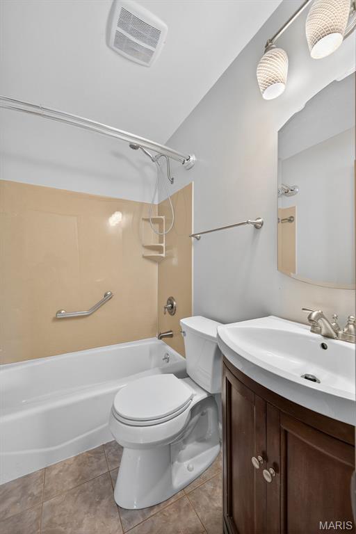 10564 Mert Ave, Saint Ann, MO 63074 - full bath featuring vanity, shower / bath combination, and tile patterned floors