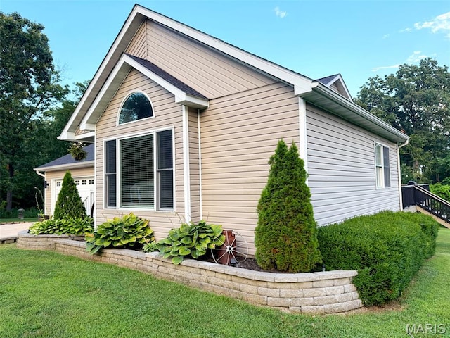885 Oak Pass Ln, Sullivan, MO 63080 - view of home's exterior with an attached garage and a yard